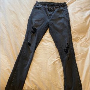 Distressed black skinny jeans
